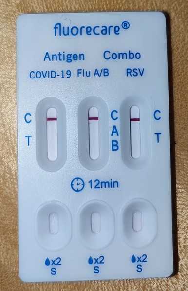 Negative self test for COVID-19, Flu A/B and RSV. Manufacturer is "fluorecare®️".