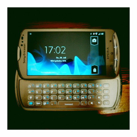 Photo of a 2011 Sony Ericsson Xperia Mk16i cell phone with slide-out physical keyboard